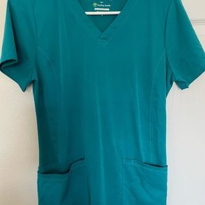Two Small identical teal healing hands scrub top